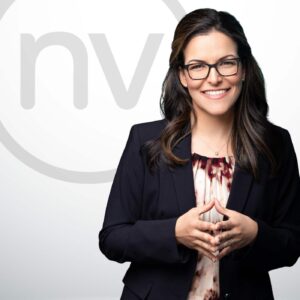 Create Brand NV Marketing Agency Tampa Owner Headshot of Professional Woman with the letters n and v behind her to represent the brand